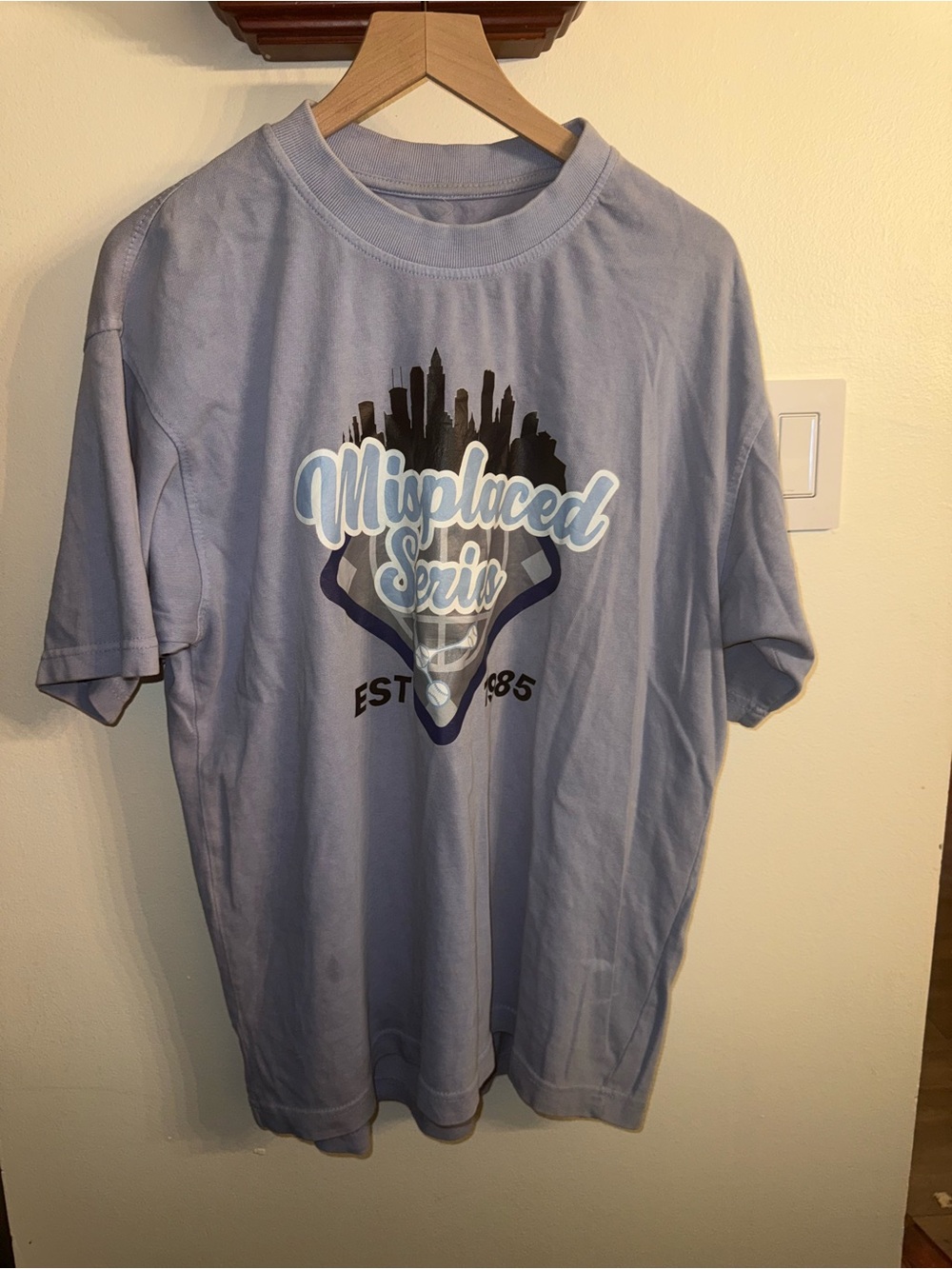 John Geiger “Misplaced Series" TPA Light Blue” tee
